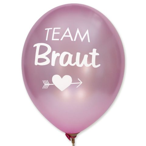 Rosa metallic Ballons mit weißem Aufdruck "Team Braut" mit Motiv darunter Herz und Pfeil durch.